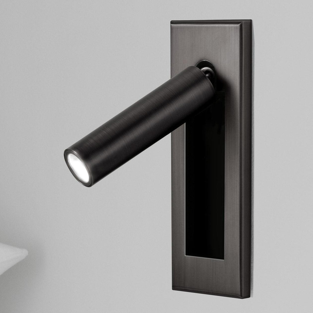 Minimalist adjustable LED reading lamp, wall sconce for modern bedroom ambiance.