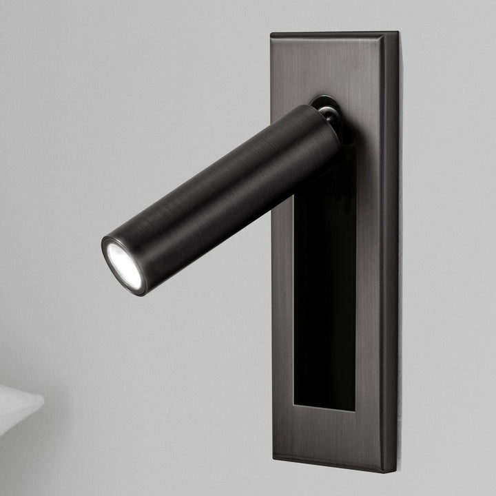 Minimalist adjustable LED reading lamp, wall sconce for modern bedroom ambiance.