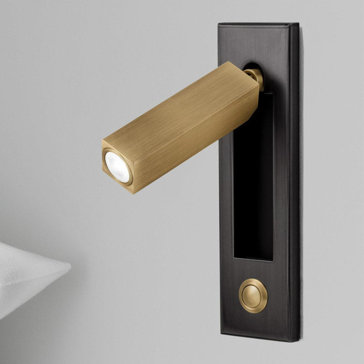 White adjustable LED bedside reading lamp, modern wall sconce for bedroom lighting.