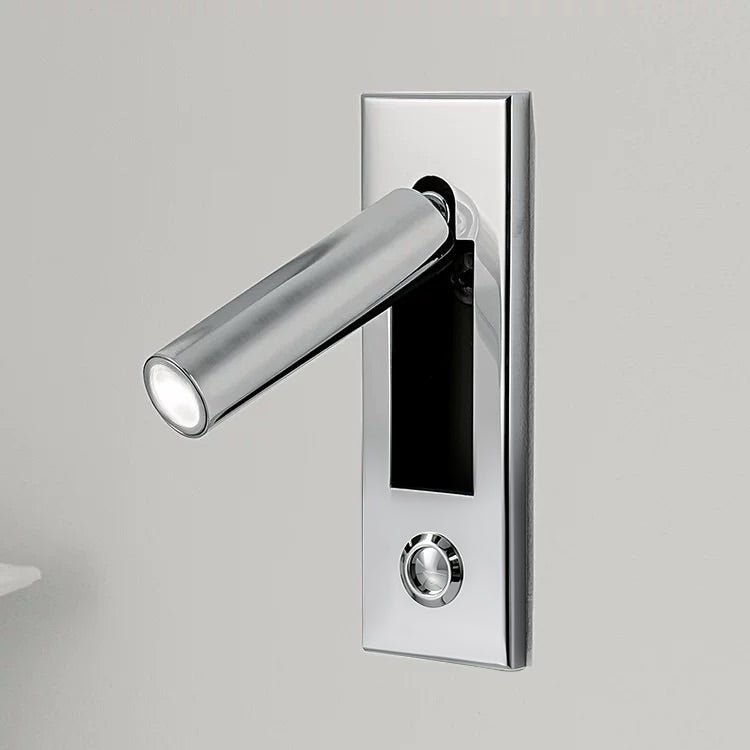 Wall-mounted LED light with adjustable beam, perfect for focused reading in bedrooms.