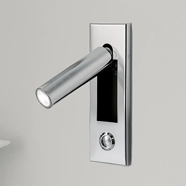 Wall-mounted LED light with adjustable beam, perfect for focused reading in bedrooms.