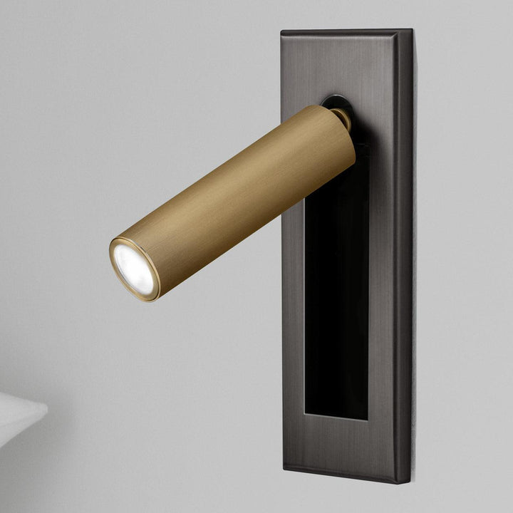 Flexible modern LED wall lamp, offering adjustable light for comfortable bedside reading.