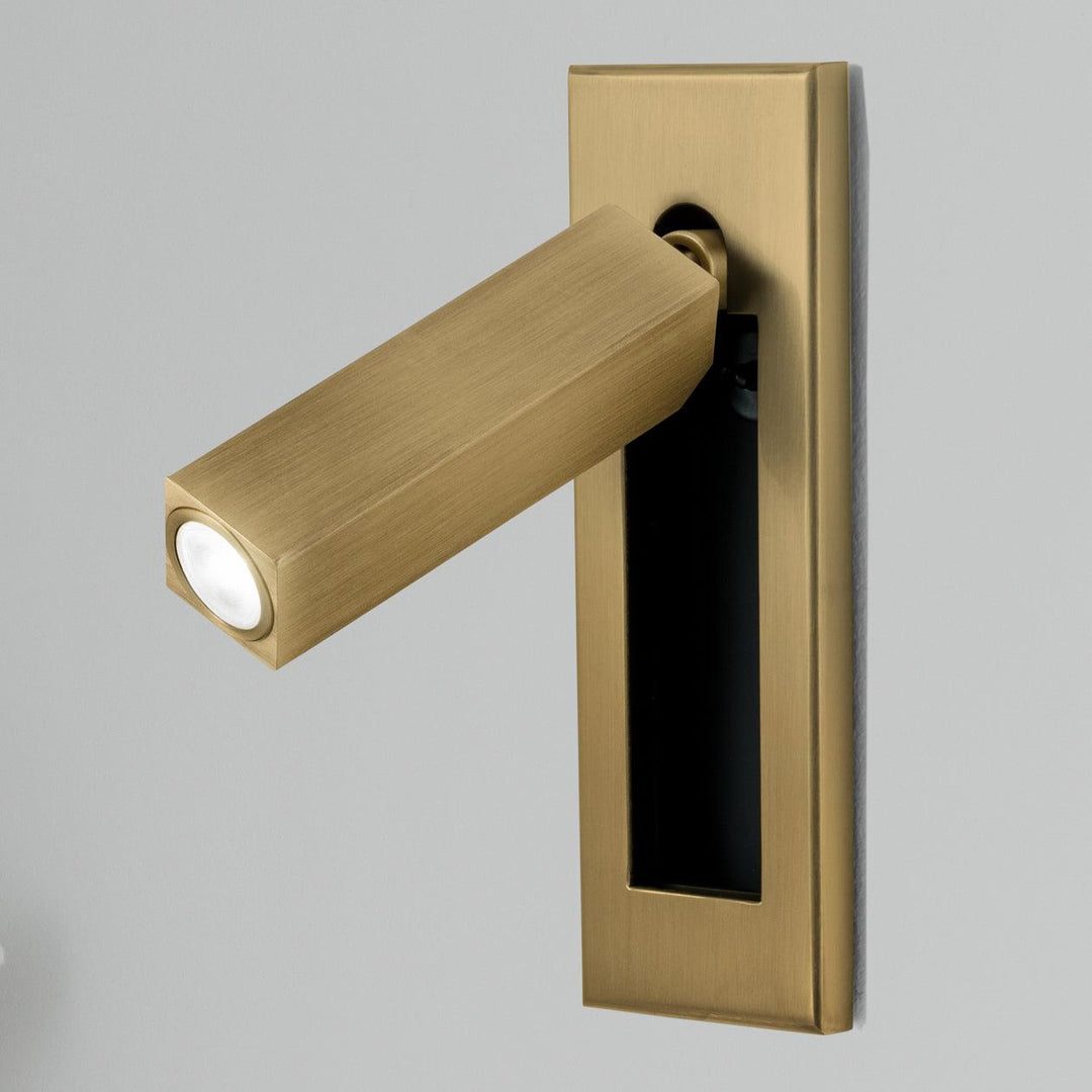 Stylish adjustable LED task light, wall-mounted bedside lamp for focused reading.