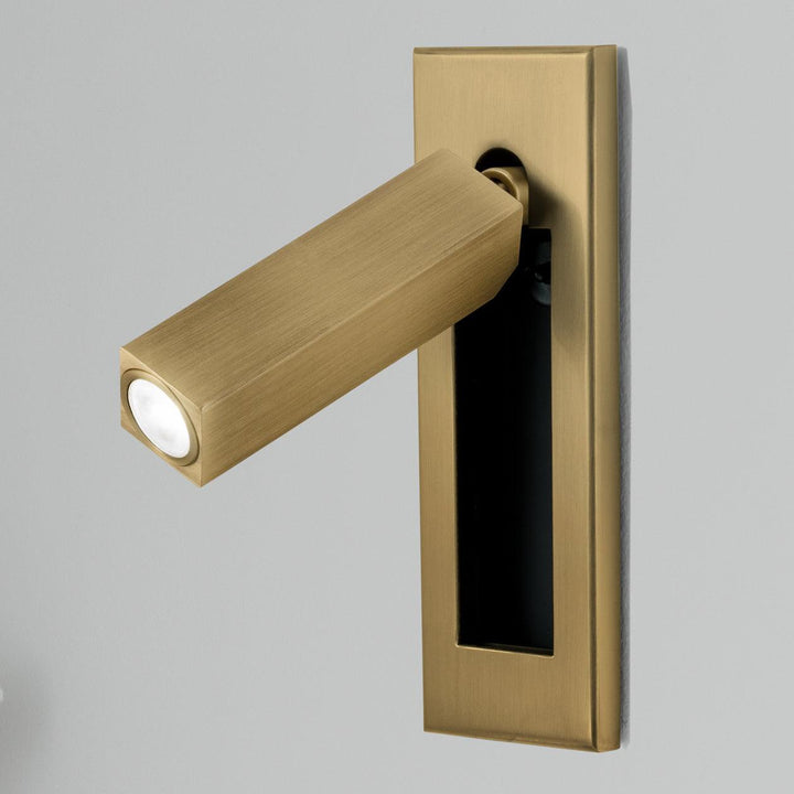 Stylish adjustable LED task light, wall-mounted bedside lamp for focused reading.