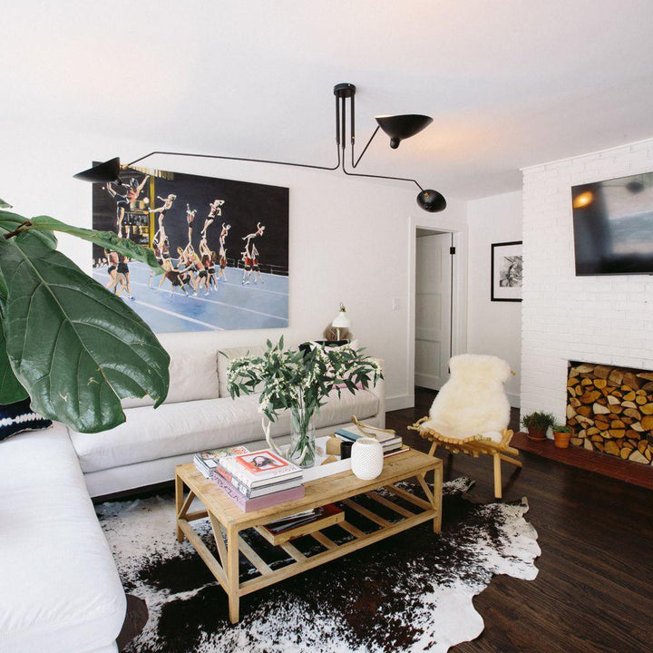 Minimalist multi-arm ceiling light, adjustable metal fixture for modern homes.