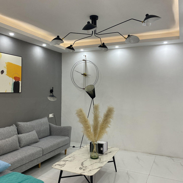 Modern adjustable multi-arm lamp, contemporary metal design for dining room lighting.