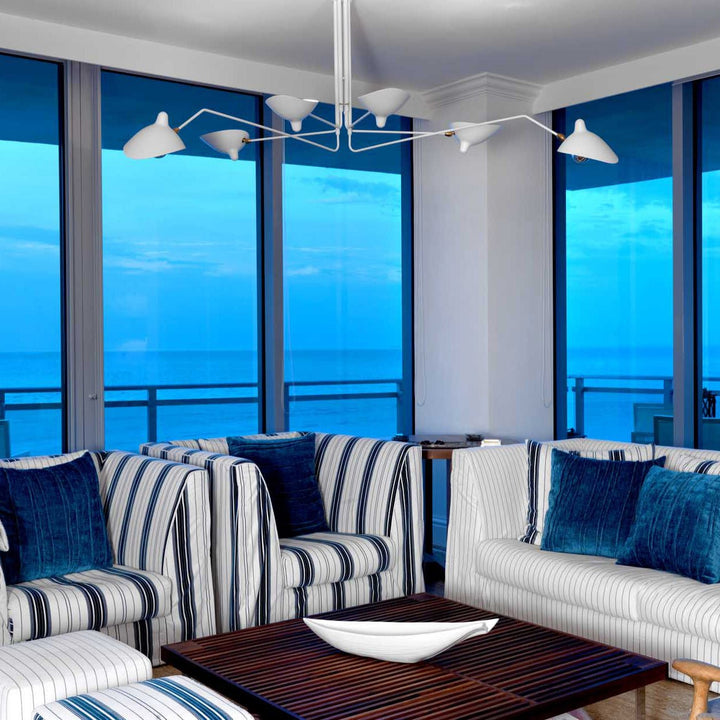 Sleek adjustable multi-arm ceiling light, elegant metal fixture for bedroom ambiance.