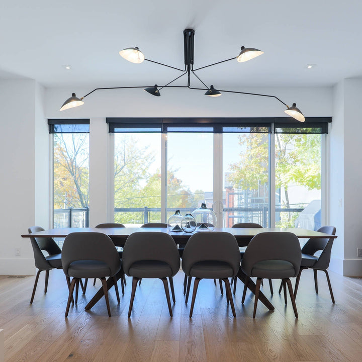 Modern adjustable multi-arm ceiling light, minimalist metal fixture for stylish home decor.