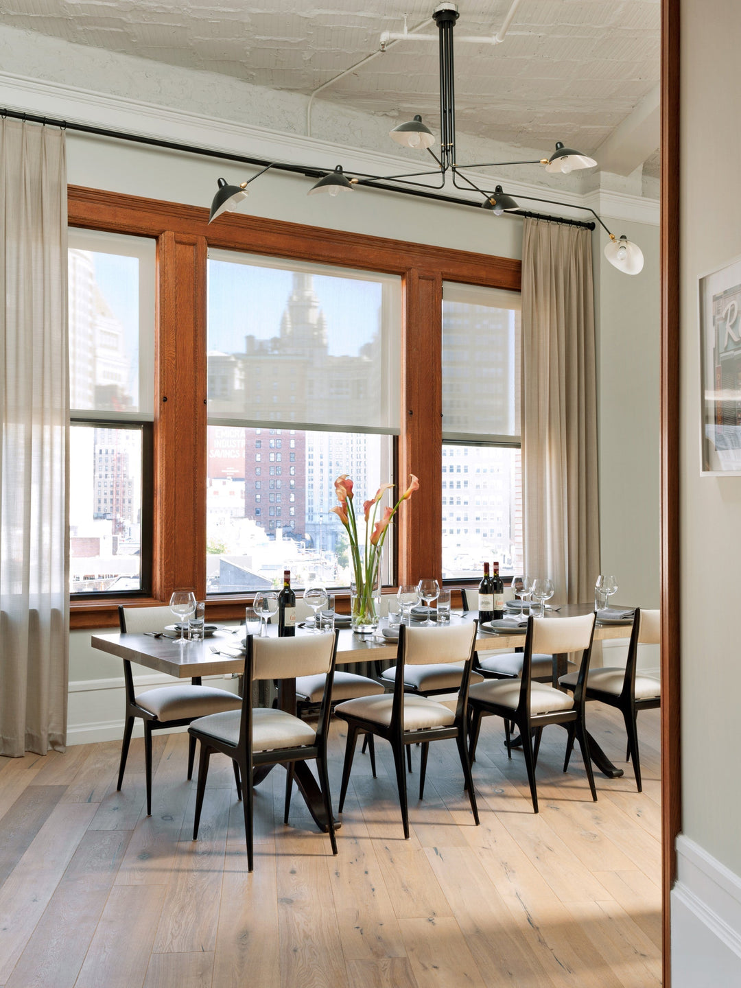 Stylish multi-arm adjustable ceiling fixture, metal for a contemporary living room.