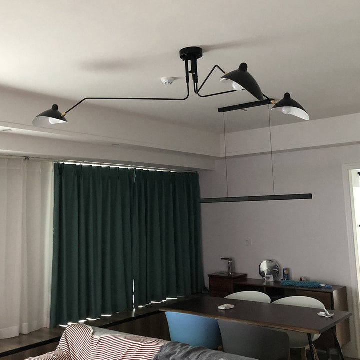 Sleek adjustable multi-arm ceiling fixture, minimalist metal design for living rooms.