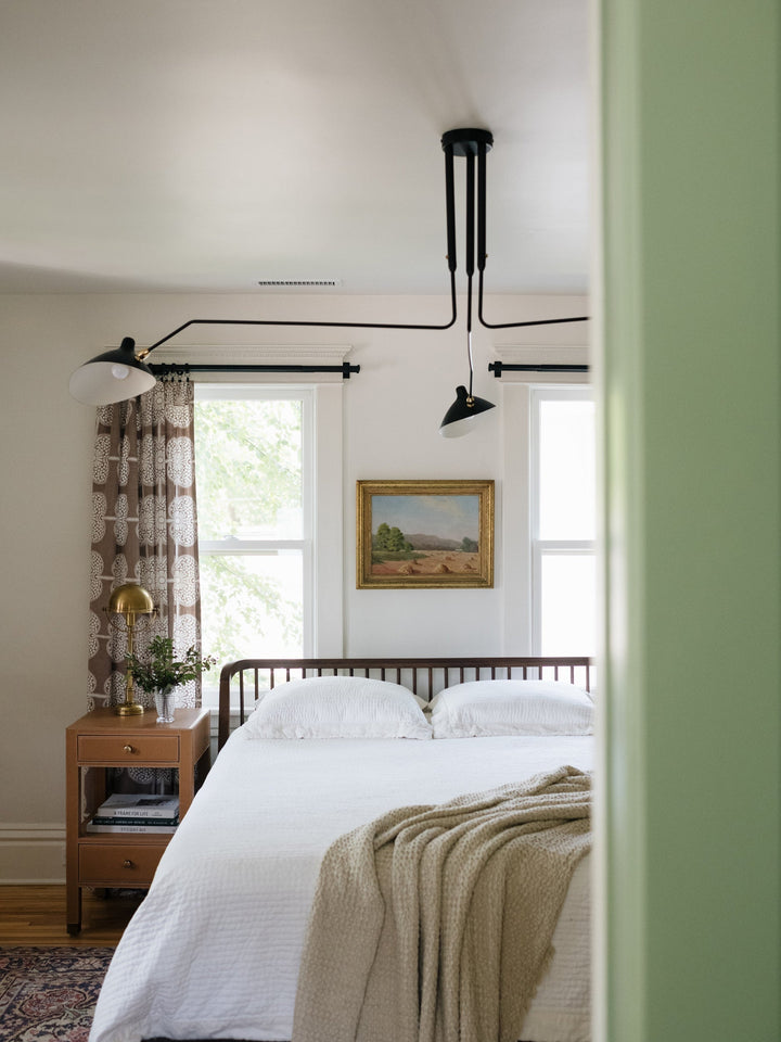 Stylish multi-arm adjustable ceiling light, sleek metal for modern offices.