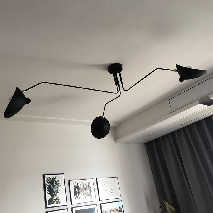 Modern multi-arm adjustable ceiling light, metal design for contemporary bedrooms.