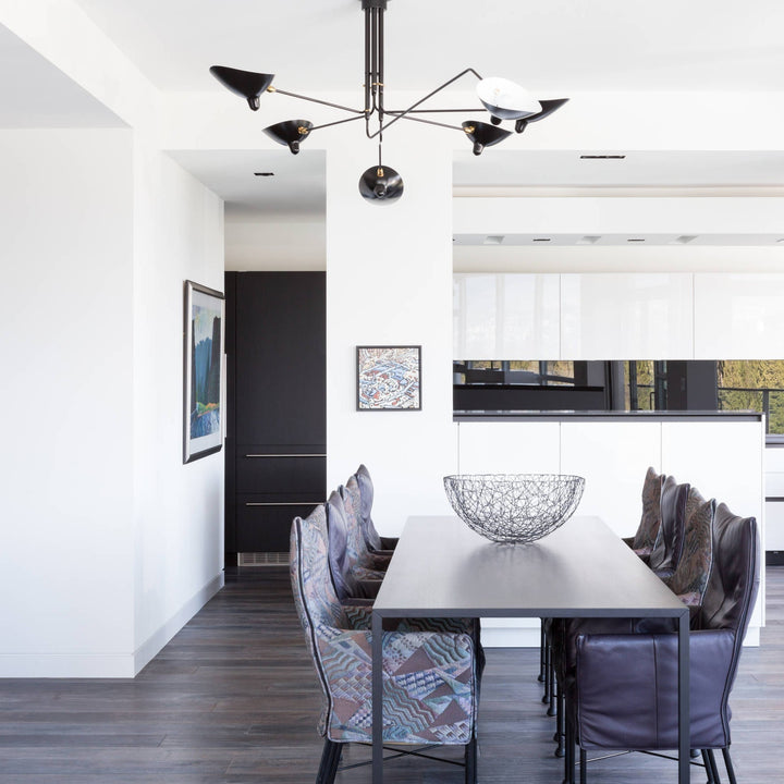 Stylish multi-arm ceiling light, adjustable metal design for sleek living room decor.
