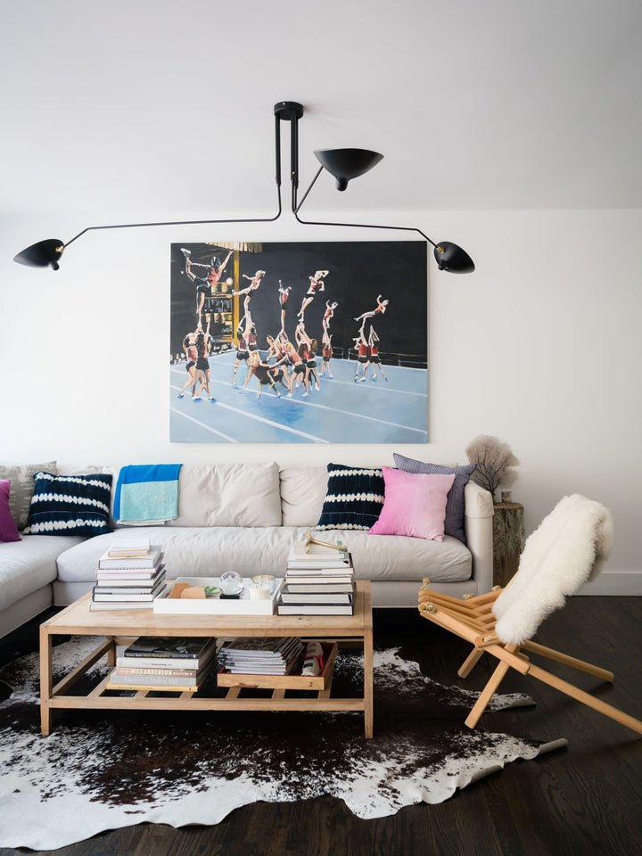 Sleek adjustable multi-arm ceiling fixture, minimalist metal for dining rooms.