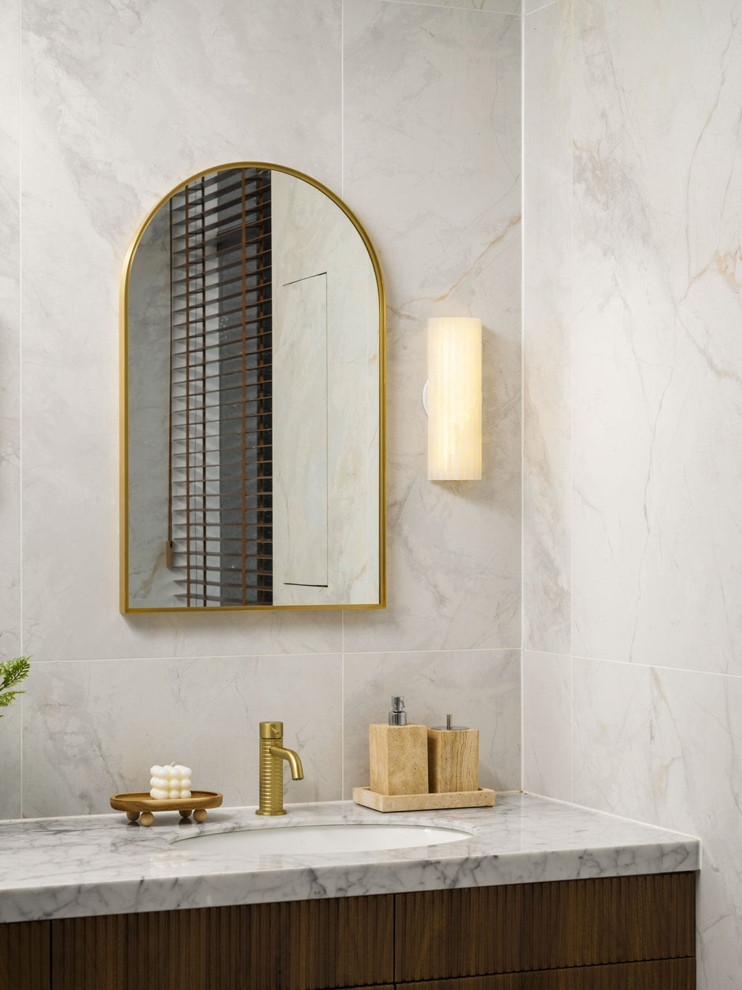 Luxury alabaster LED wall lamp for ambient indoor lighting in modern homes.