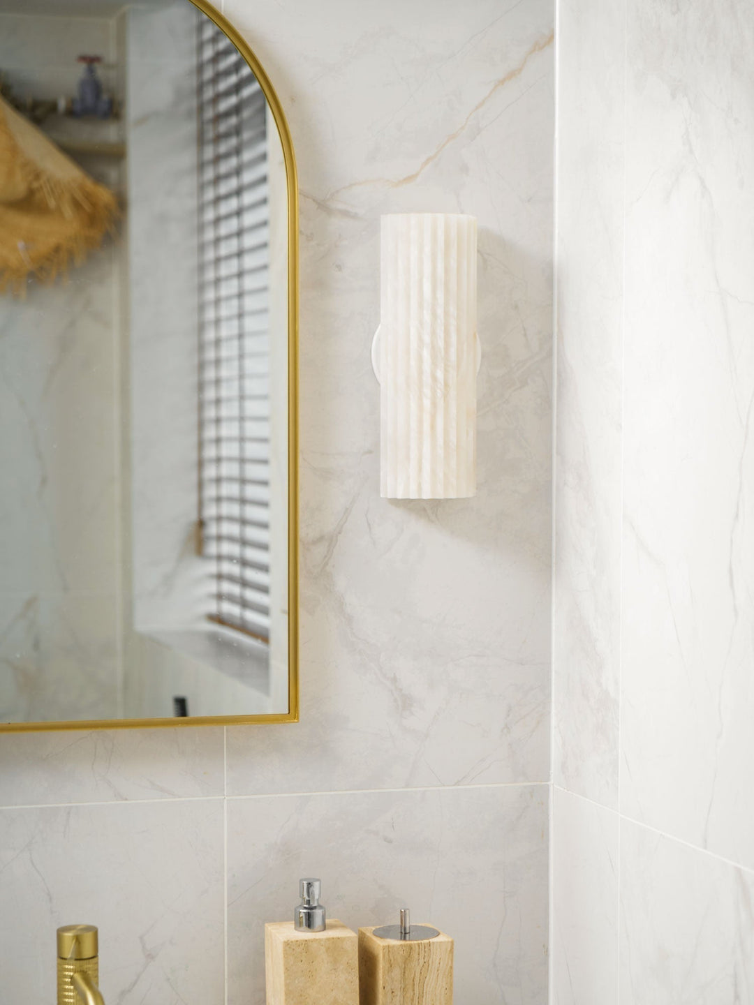 Architectural alabaster LED wall sconce, elegant and functional for discerning homeowners.