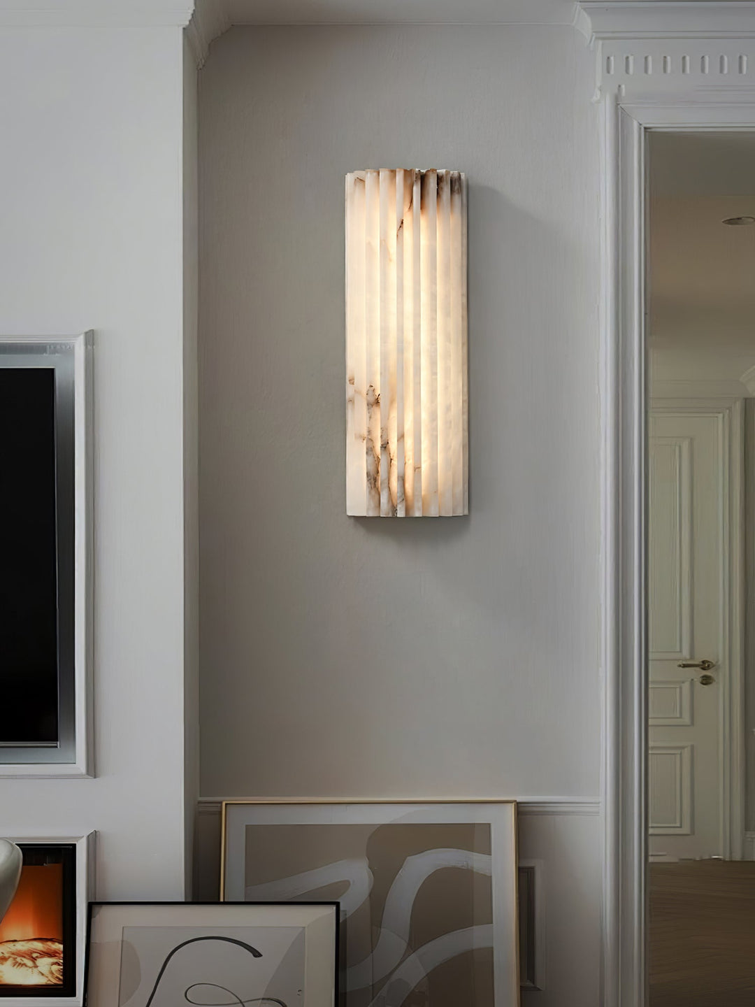 Elegant LED wall sconce, alabaster finish, perfect for modern living spaces.