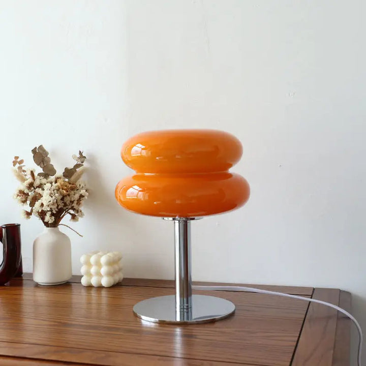 Timeless Bauhaus style LED table lamp, wireless & dimmable, enhances modern living space.