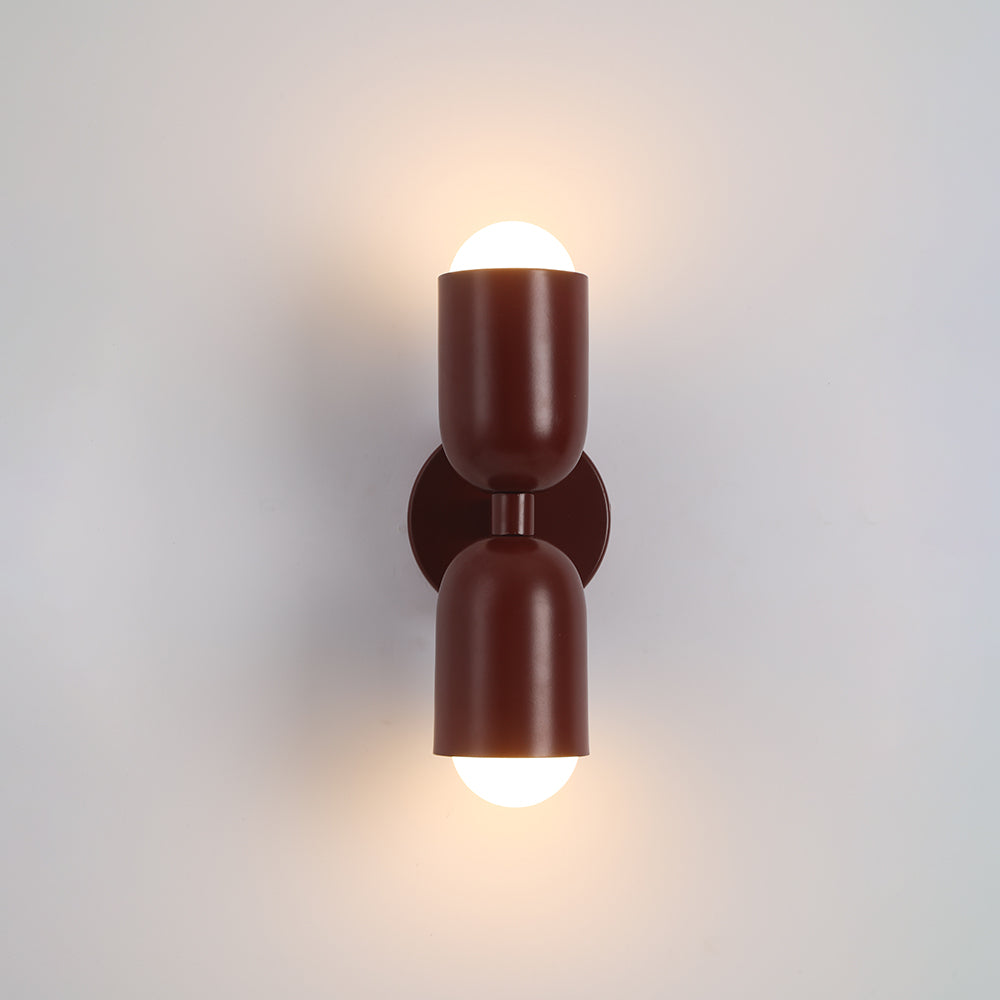 Artistic red cylinder LED wall sconce, vibrant accent for modern spaces.
