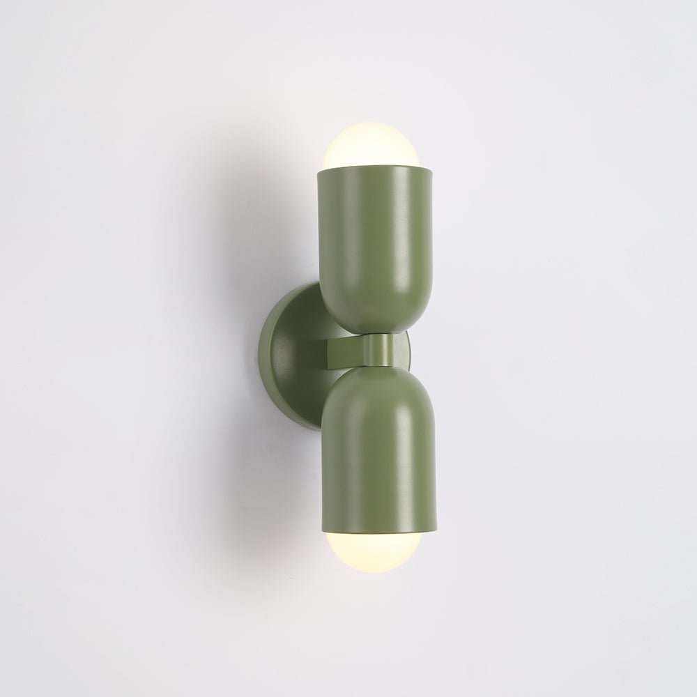 Black matte finish cylinder LED wall lamp, sleek contemporary design for walls.