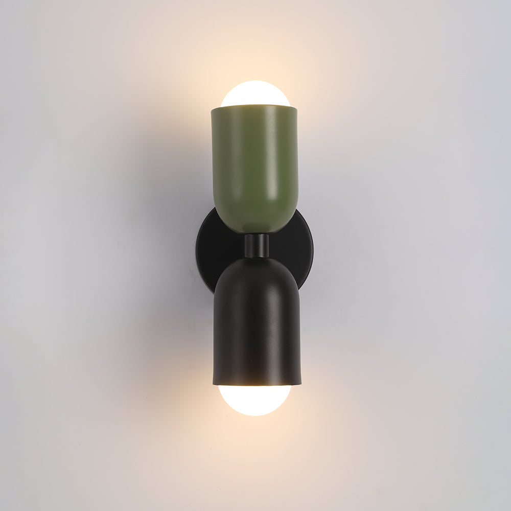 Polished chrome LED wall lamp, cylindrical, adds a reflective touch to decor.