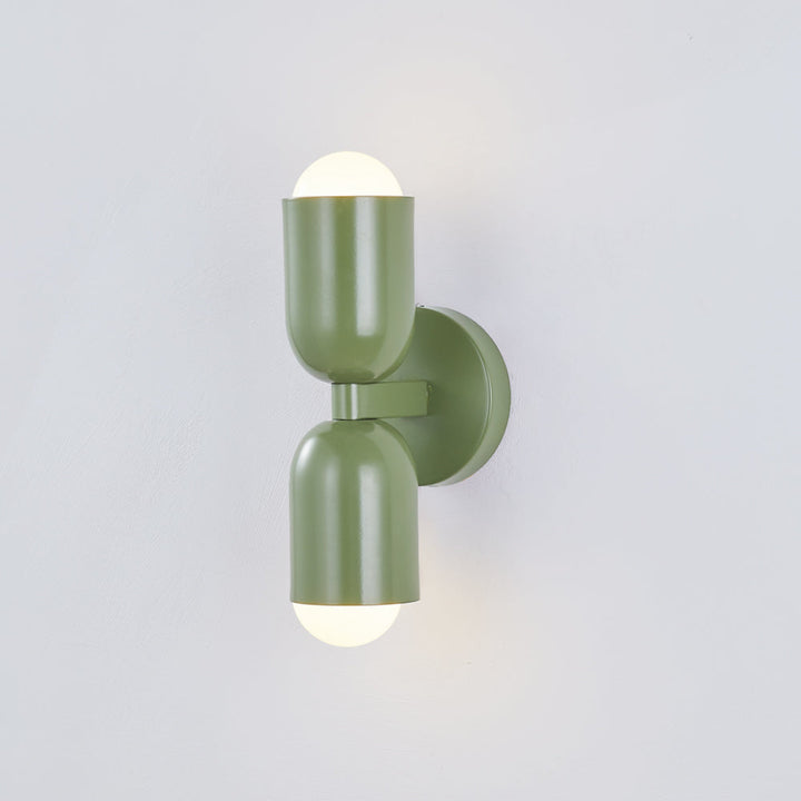 Copper tone LED wall fixture, cylinder shape, unique industrial accent lighting.