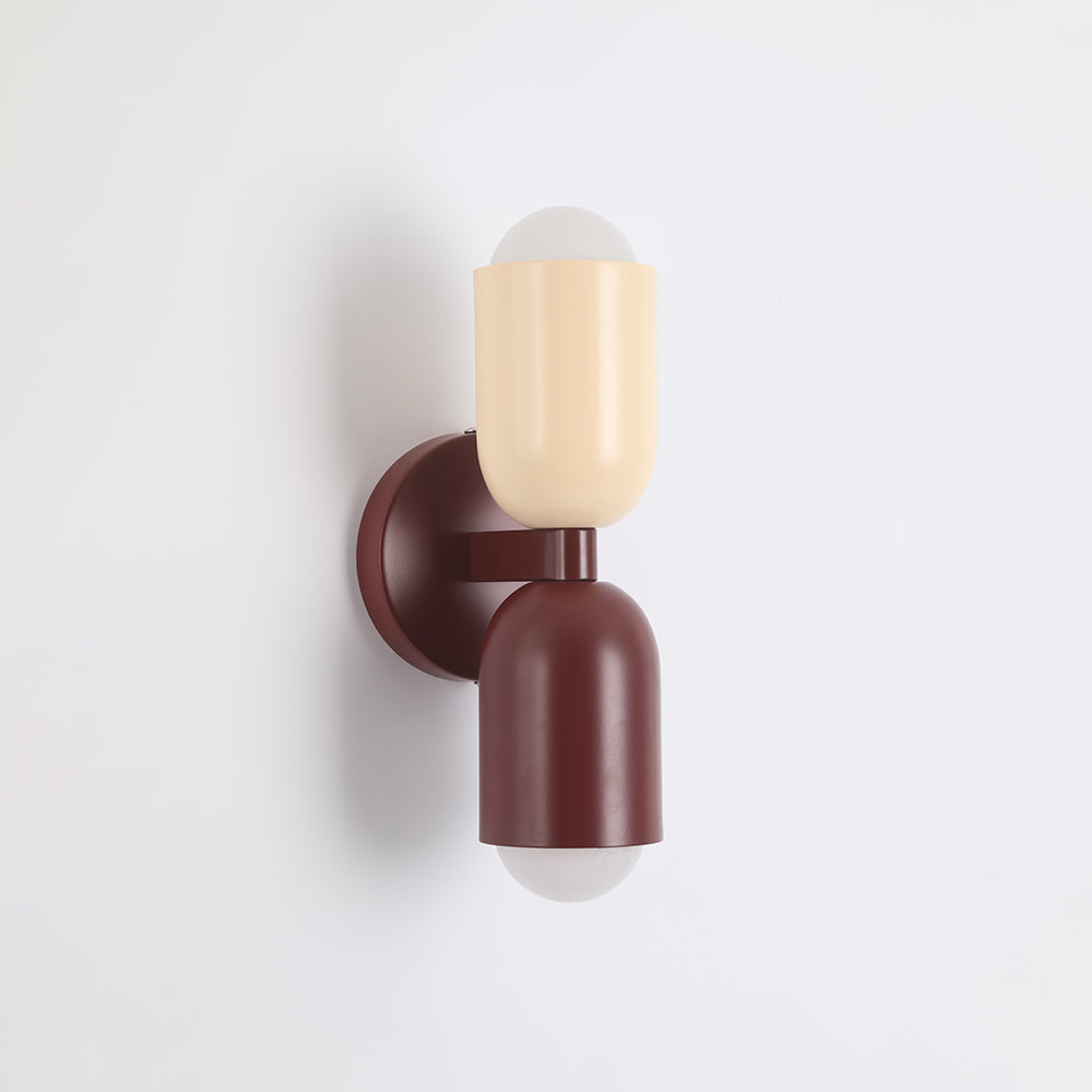 Dimmable modern LED wall sconce, cylindrical, perfect for mood lighting.