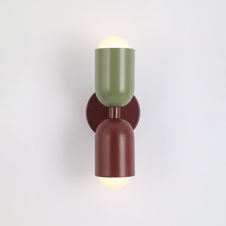 Compact modern LED wall light, cylinder shape, ideal for small spaces.