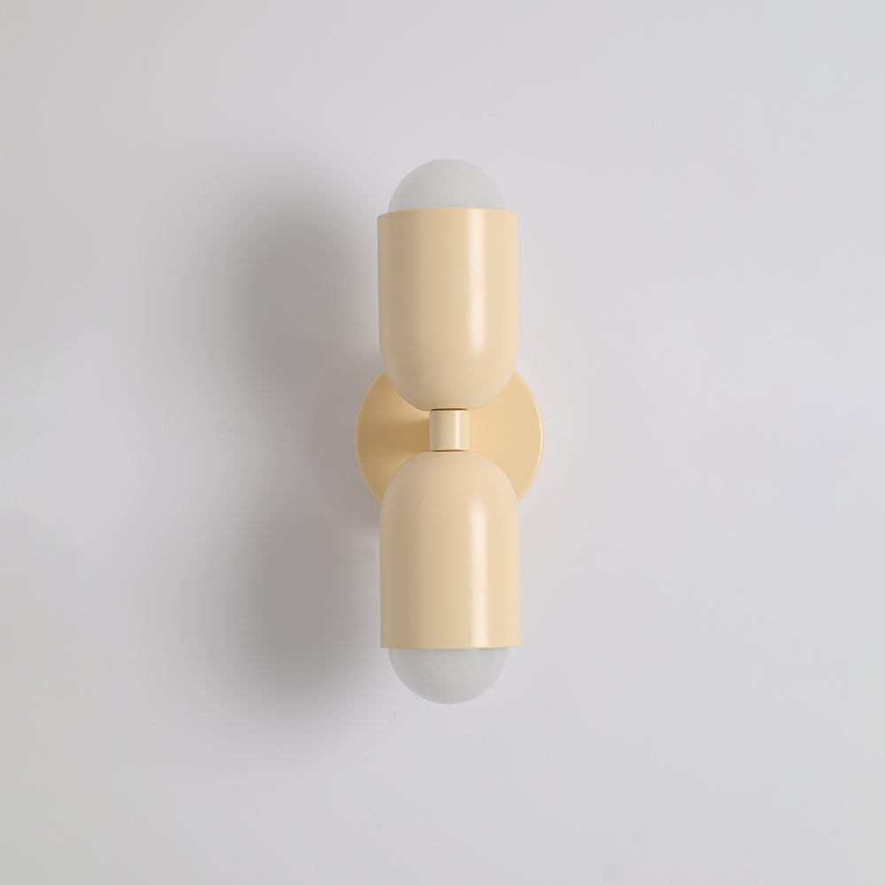 Sleek modern LED cylinder sconce, provides focused and diffused light.
