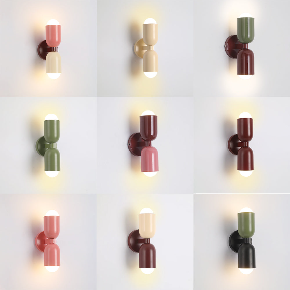 Stylish chrome cylinder LED wall fixture, perfect for modern bedroom or hallway.