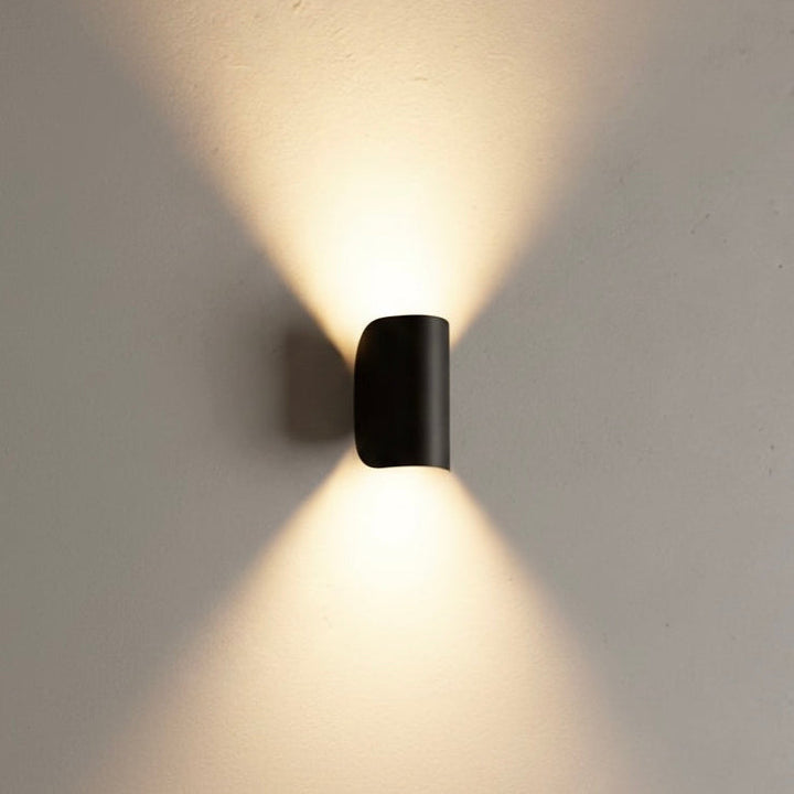 Modern black LED up down wall sconce light fixture, perfect for contemporary indoor or outdoor lighting.