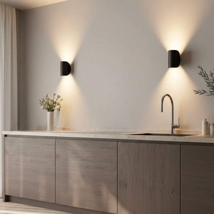 Sleek white LED wall sconce offering energy-efficient up down ambient lighting for hallways.