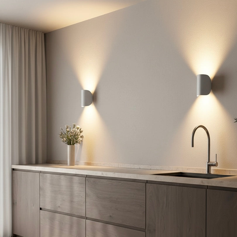 Black modern LED up down wall light fixture, providing ambient illumination for any room.