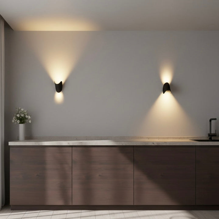 White contemporary LED up down sconce, a decorative and functional light for modern homes.