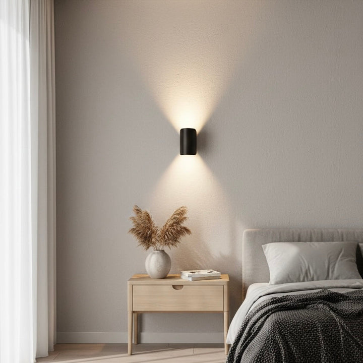 Modern LED wall sconce, delivering elegant up down light for contemporary home interiors.