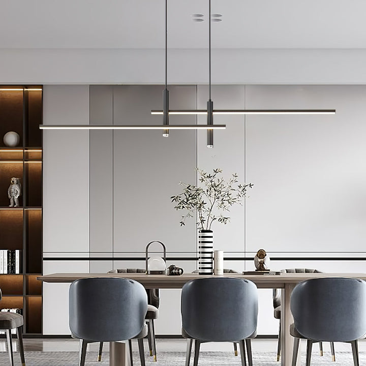 Black linear LED pendant. Adjustable, sleek design for modern kitchens & dining room home decor.