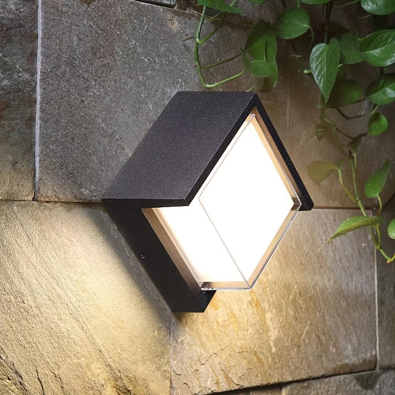 Sleek LED outdoor wall lamp with motion sensor, providing security lighting for modern homes.