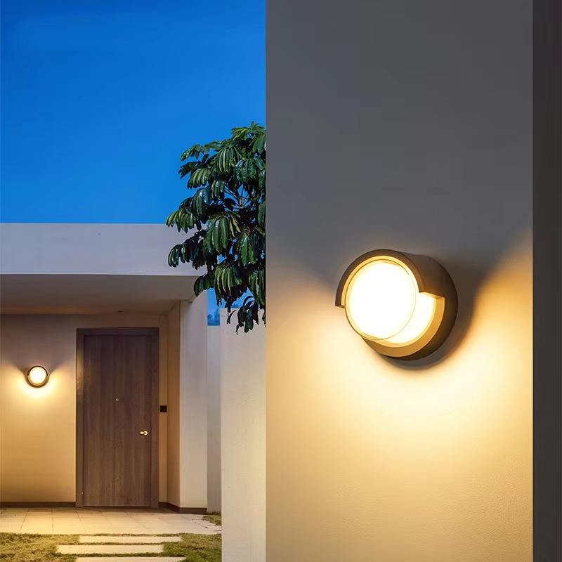 Black modern outdoor wall lamp, LED, motion sensor, waterproof for enhanced home security & exterior.