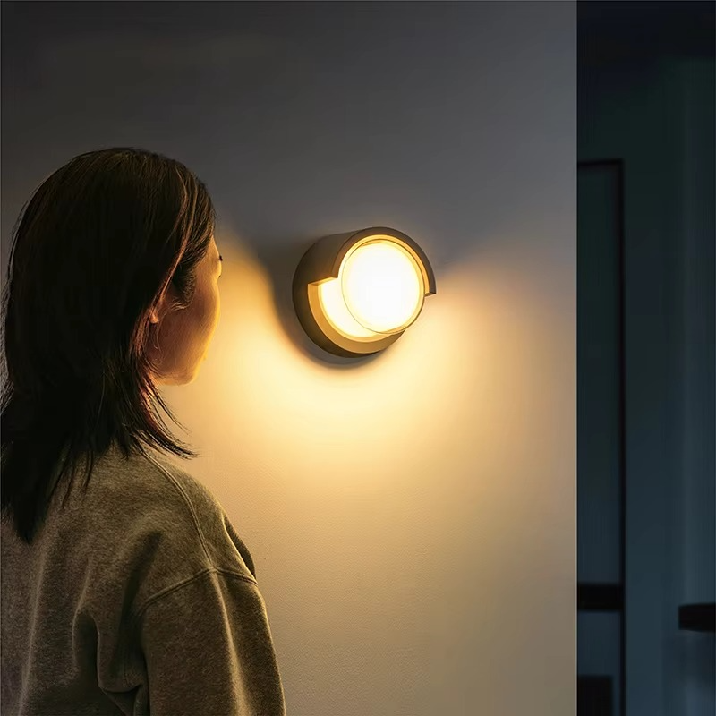 Enhance home security with this contemporary LED outdoor wall lamp, featuring a responsive motion sensor.