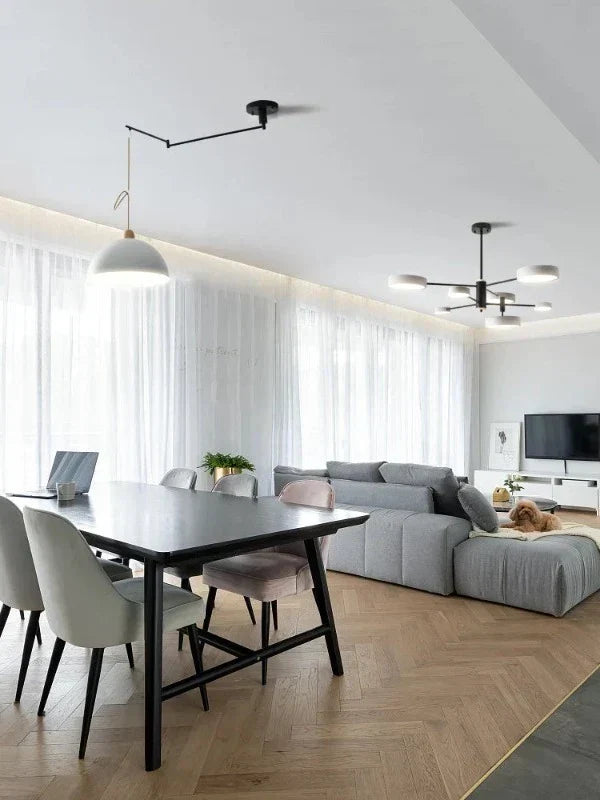 Stylish ceiling light featuring adjustable arms, ideal for dynamic white light in modern interior decor.