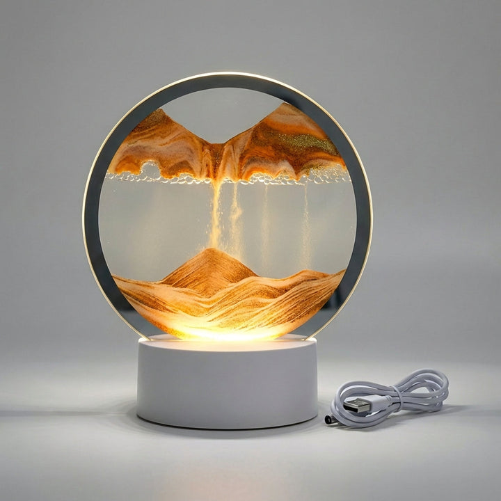 Mesmerizing flowing sand LED table lamp with a modern circular design. Provides ambient light for home decor.