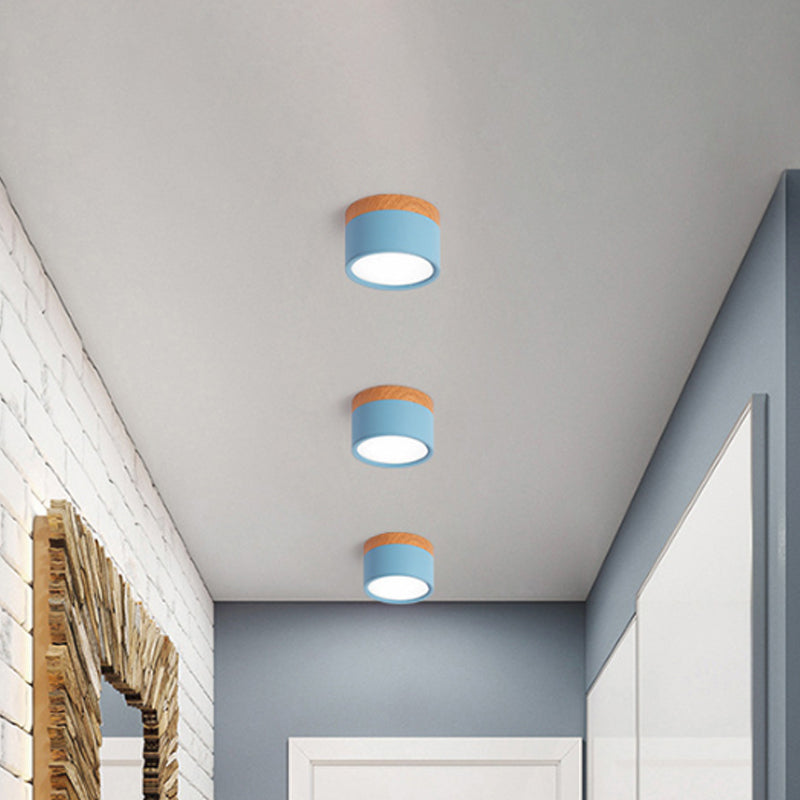 Modern compact cylindrical LED flush mount ceiling light, perfect for contemporary home decor & kitchen lighting.