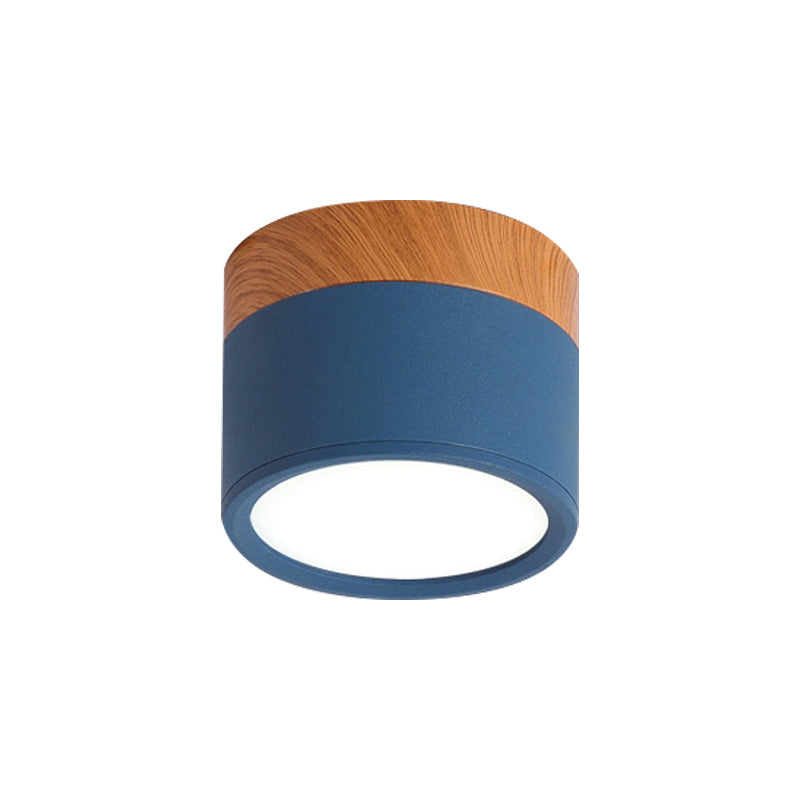 Modern compact LED flush mount ceiling fixture, providing energy-saving light for stylish home & bar interiors.