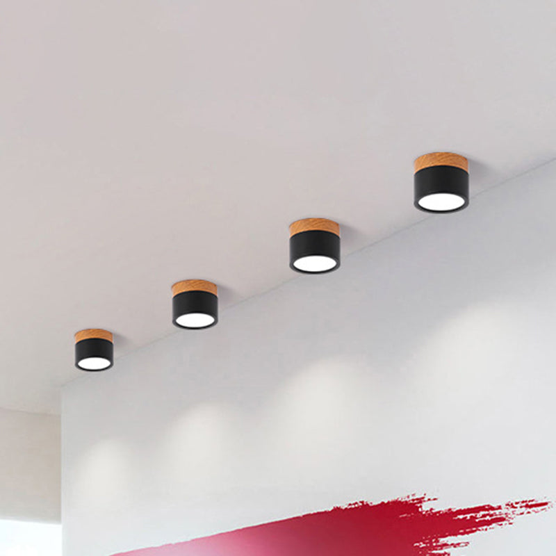 Sleek cylindrical LED flush mount ceiling light, a modern and compact lighting solution for your home kitchen.