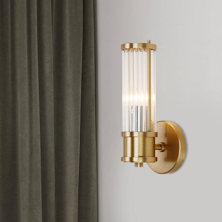 Elegant gold wall lamp with sparkling crystal cylinder, perfect modern accent light for any room.