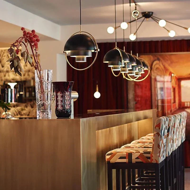Elegant modern pendant lamp, perfect for dining room lighting. Features adjustable LED & minimalist design.