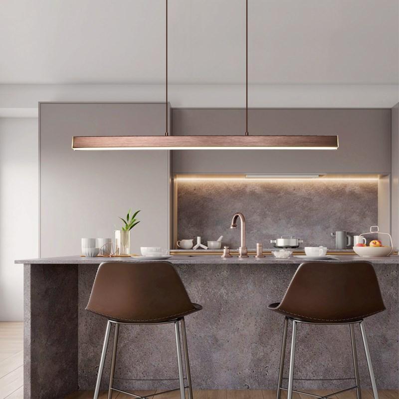 Versatile LED pendant light, adjustable height and brightness, ideal for modern kitchens.