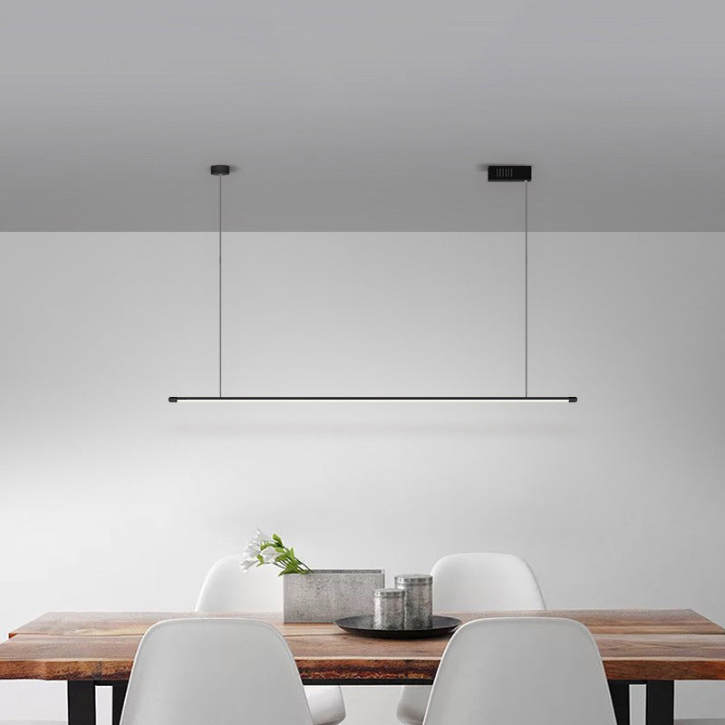 Bright, dimmable linear LED pendant light in modern black for kitchen islands.