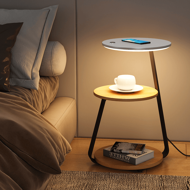 Elegant double-layered end table for bedroom decor, stone top, steel frame, and storage.