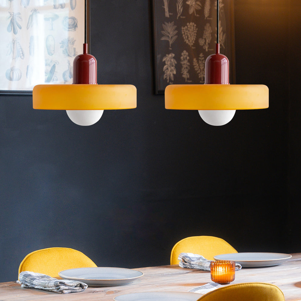 Modern living room double pendant light with sleek glass design, ceiling mounted.